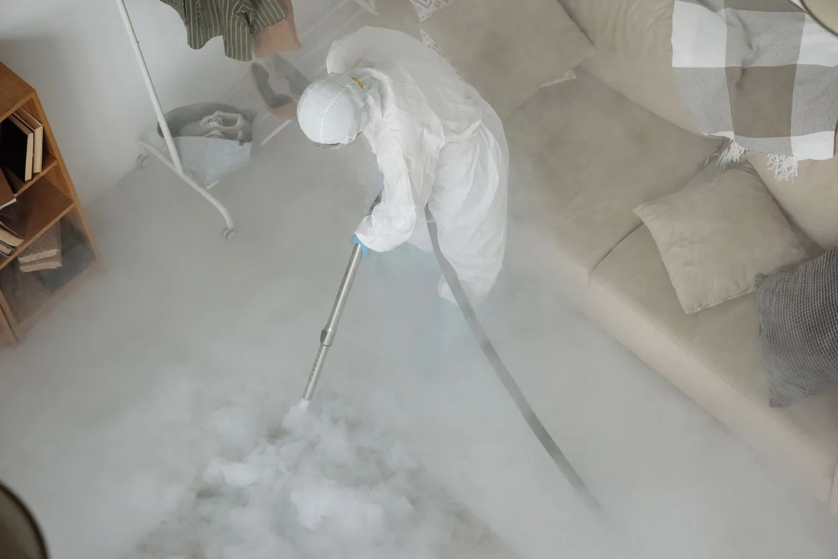 Biohazard cleanup technician in protective equipment, Redwood, OR
